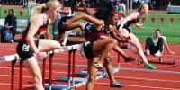 Sophomore Kori Carter, center, had a great Sunday at the Stanford Invitational, winning the 100-meter hurdles with a time of 13.19 and also helping the Cardinal contingent win the 4x100-meter relay. (MADELINE SIDES/The Stanford Daily)