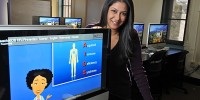 Priya Sorcar, a Stanford grad, is the founder of TeachAIDS, an organization aimed at creating animations to educate individuals across the world about AIDS. Here, she is photographed with a computer screen featuring one of the educational animations. (GLENN ASAKAWA/University of Colorado)