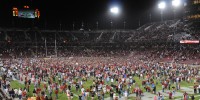 Stanford fans storm the field after the Cardinal's improbable 21-14 upset of USC on Saturday night. (SIMON WARBY/The Stanford Daily)