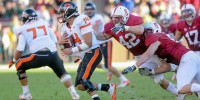 Redshirt senior linebacker Alex Debniak (42) sacked Oregon State quarterback Cody Vaz (14) on a key third-down play to help Stanford beat the Beavers and set up Saturday's showdown with No. 2 Oregon. (SIMON WARBY/The Stanford Daily)