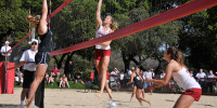 The No. 1 pairing of junior Carly Wopat (center) and freshman Jordan Burgess (right) won Stanford's first ever sand volleyball game 2-0 at the ACSR Sand Volleyball Courts on Tuesday. (ZETONG LI/The Stanford Daily)